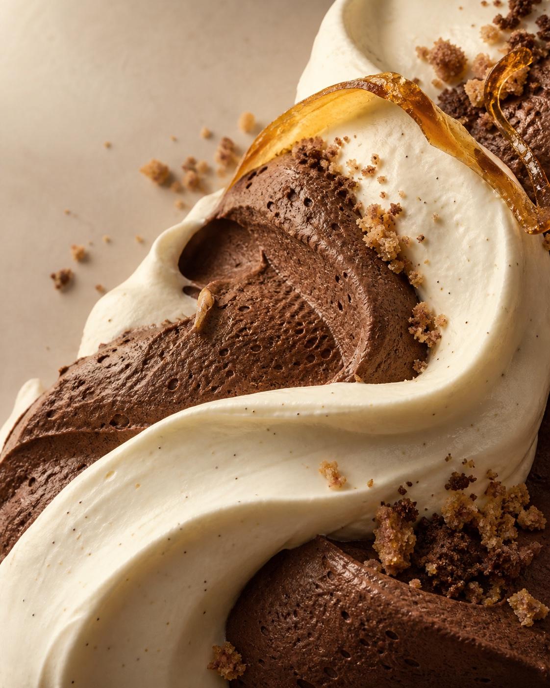 Soft vanilla cream folded over chocolate mousse with a delicate caramel ribbon