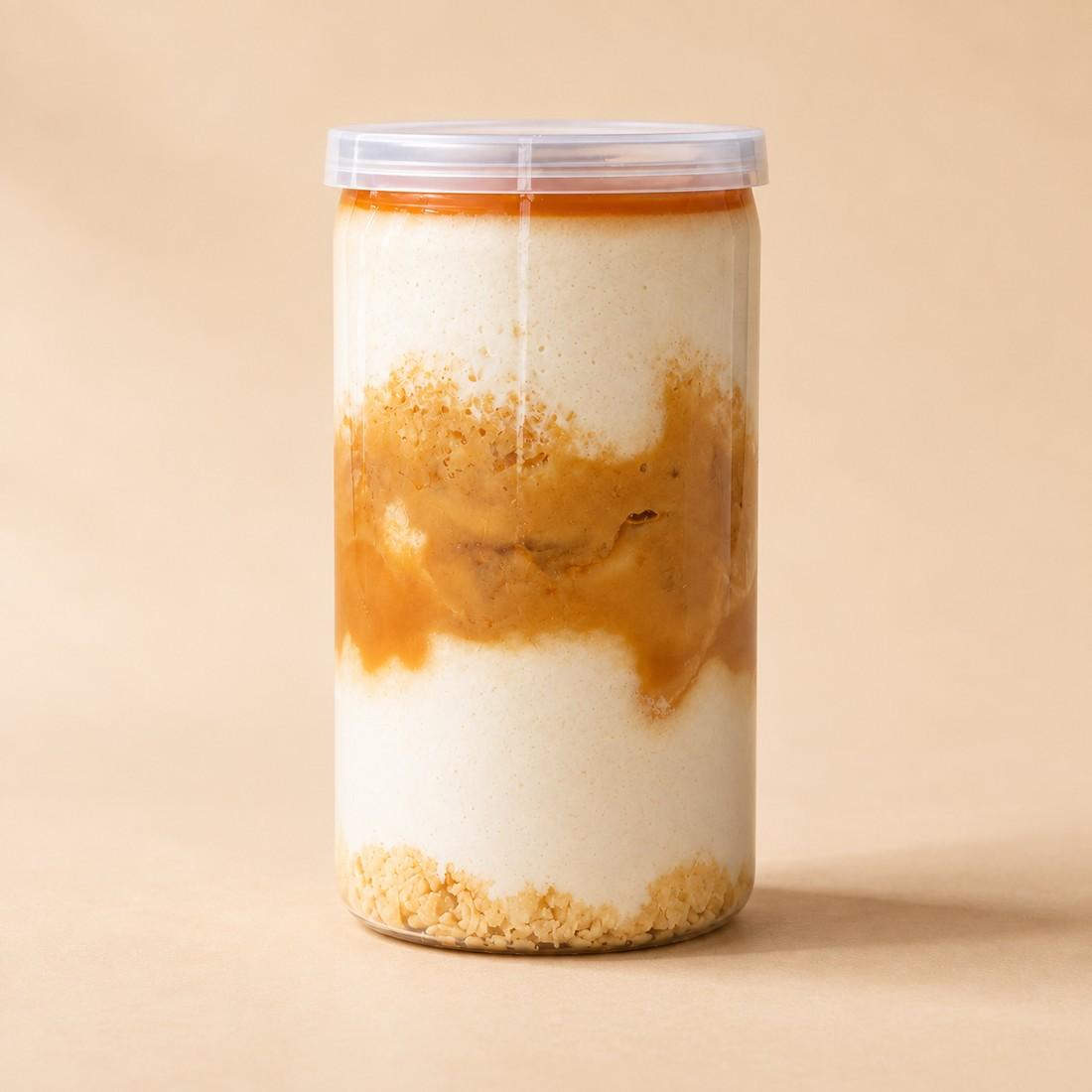 Banana mousse, caramel and hazelnut crumble layered in a clear CRMY dessert jar
