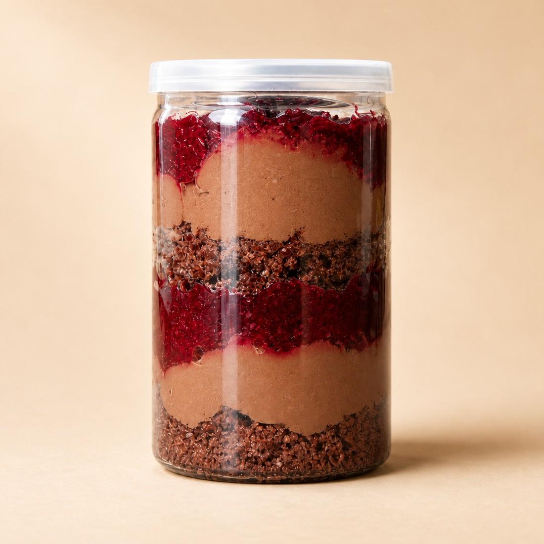 Chocolate sponge, vegan ganache and cherry compote layered in a clear CRMY dessert jar