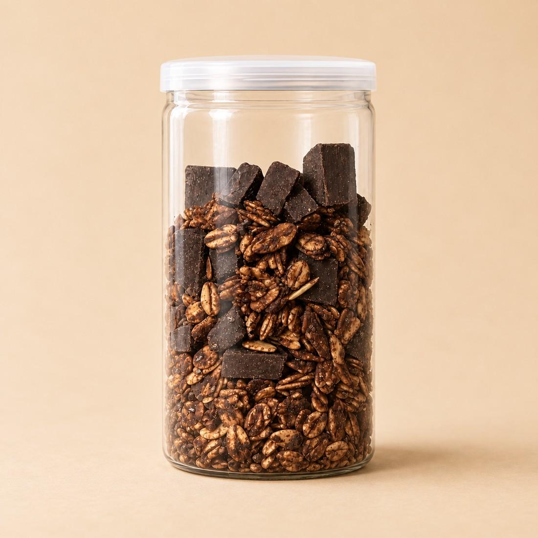 Dark chocolate oat and seed granola in a clear CRMY snack jar